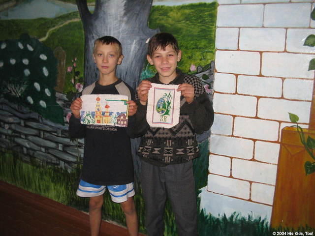 These young boys were proud of their needlpoint.  Children are regularly taught this craft.