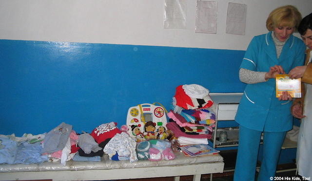 The head Dr. is inspecting the donations.  They are thrilled to have the sponsorship, and are good stewards of the donations.
