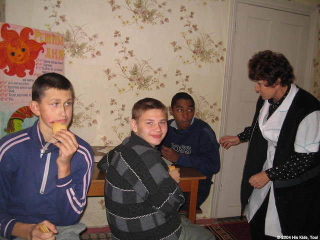 These handsome teens work on a puzzle.