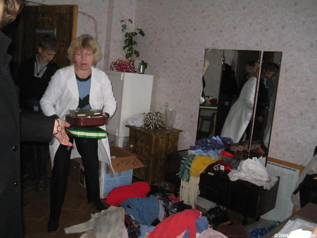 Inventory personnel look at the donations.