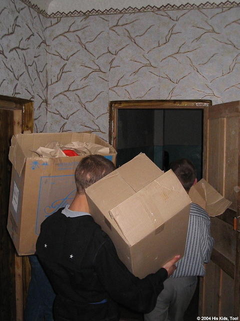 The residents help carry boxes.