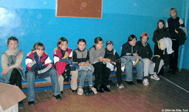 Here the older girls receive their clothing and gifts.