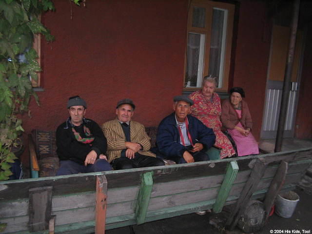 Several residents sit outside visiting.