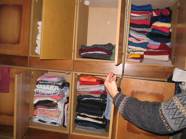 They carefully have clothing sized for easy distribution to children.