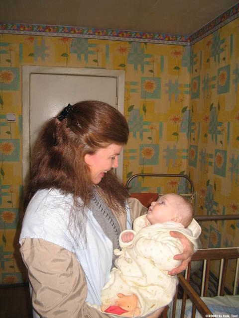 His Kids, Too! director, Teresa Fillmon, holds this 4 month old baby in her new  Winnie the Pooh sleeper, thanks Anne H.