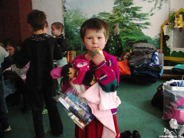 Oksana has an arm load of clothing, shoes and more!