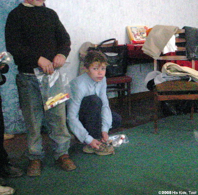 Some try on shoes while waiting.