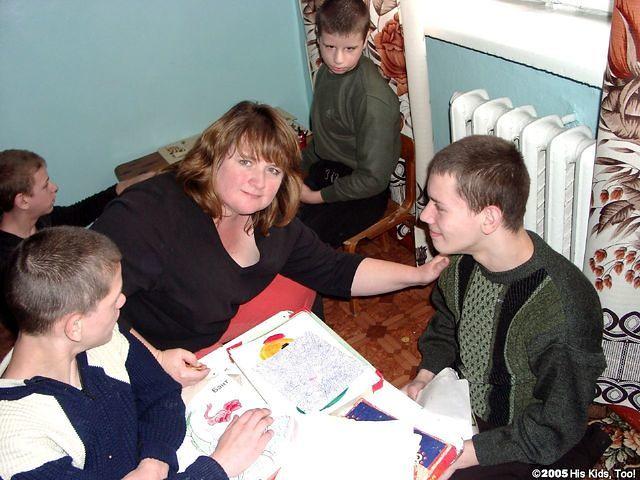 Erin does not allow a language barrier to keep her from interacting with the kids.