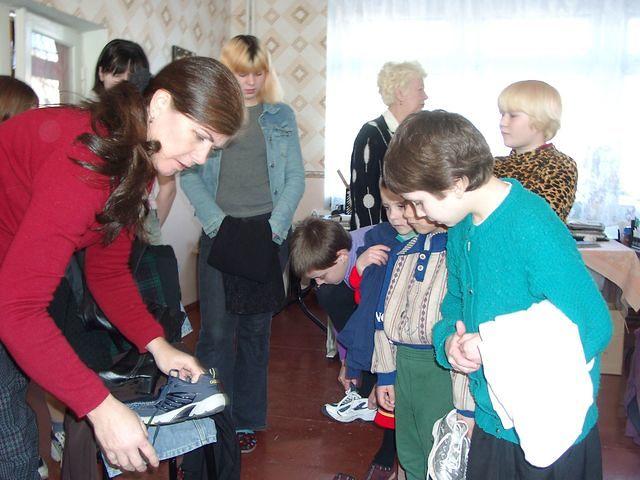 The girls are happy with their shoes.
