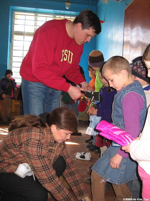 Denis assists with finding sizes.