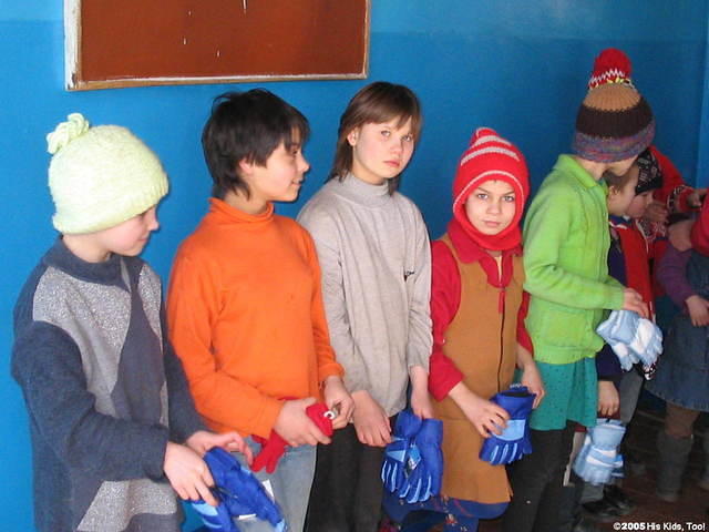 The youngest girls patiently await their turn to choose.