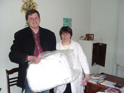 His Kids, Too! board member, Denis, presents over 200 clothe diapers to the Teremok Ortho. hospital, special thanks to Walter St