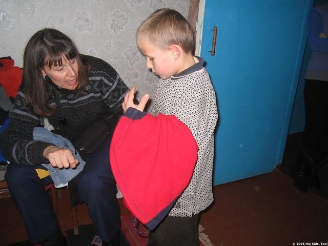 Children look through clothing and make choices.