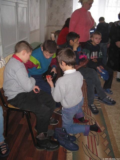 The boys compare matchbox cars.