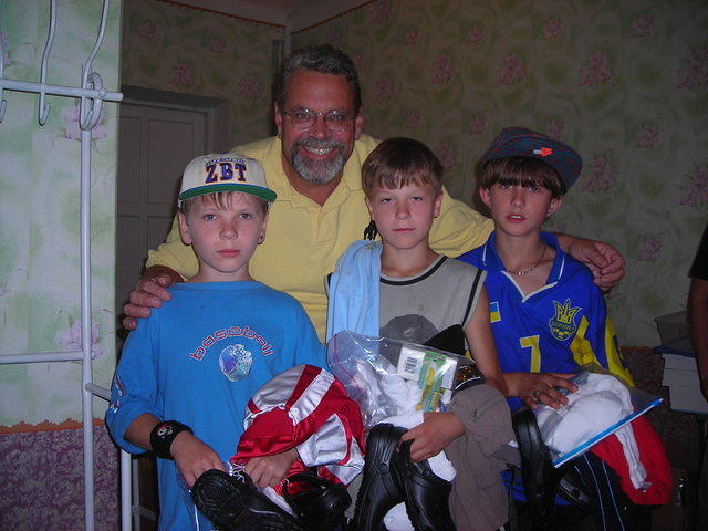 These young boys had arm loads of clothing, shoes, and a personal care bag.