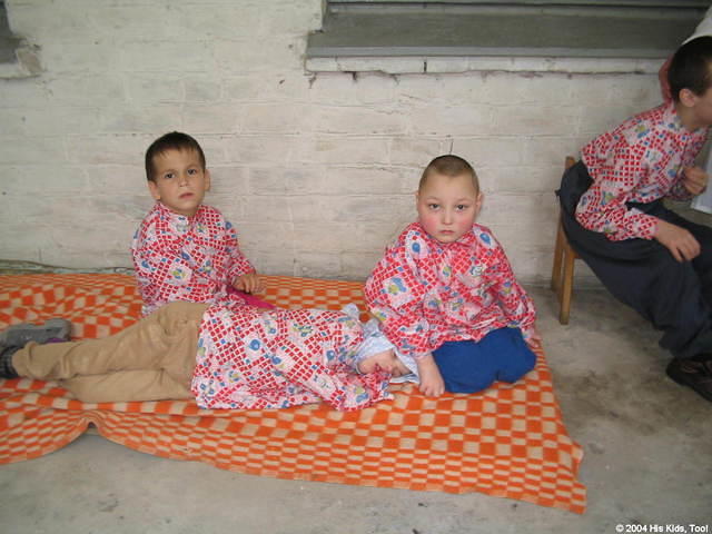Children were everywhere at this facility.  Here some are resting in the shade of the covered porch.