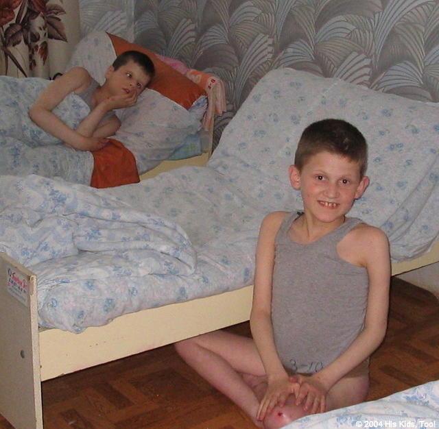 This boy was thirlled that I pointed the camera at him!  Here the children are preparing for a afternoon nap.