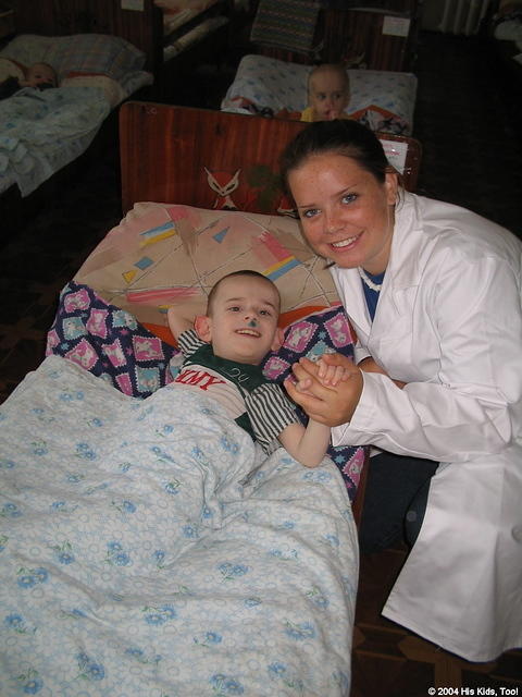 His Kids, Too! volunteer, Lydia, visits with an 11 yr. old boy.