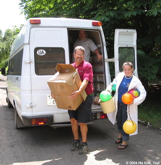 Here, His Kids, Too! board member,  Rich Fillmon, and volunteer Lydia, carry much needed supplies to the facility.