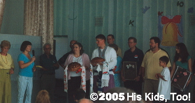 At the close of camp, the school director presented the group with the traditional bread.