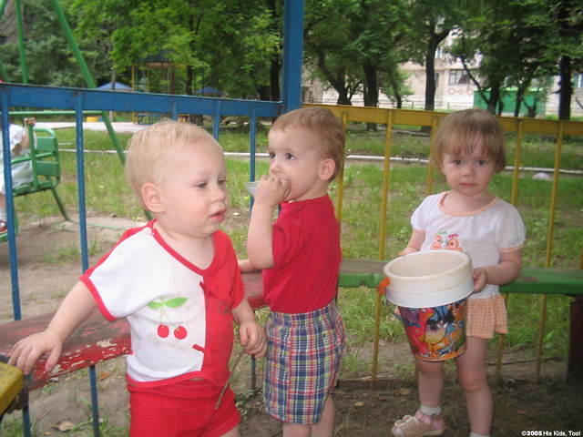 These 3 yr. olds enjoy outdoor play.