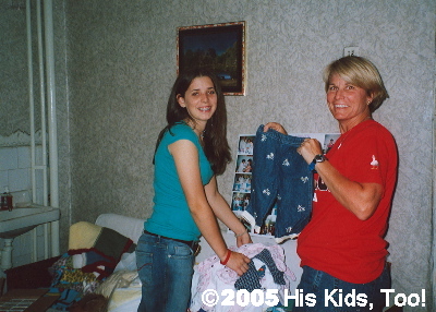 Haley and Karen sort clothes to match up outfits.
