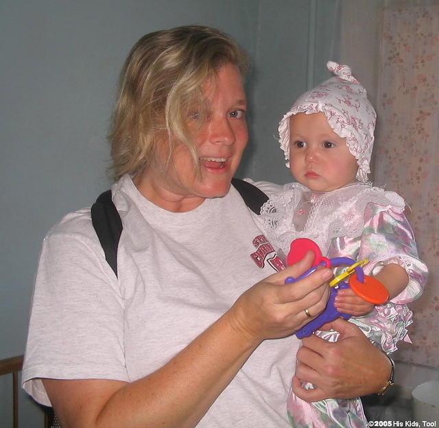 Kristy give this little girl a new toy.