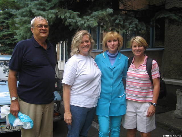 Walter Lee, Kristy and Karen, poise with our friend, and head floor nurse for the orphan ward.