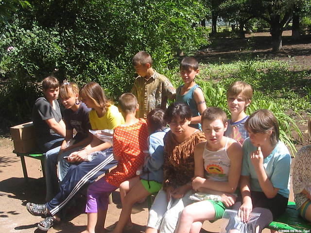 Teen girls listen attentively.
