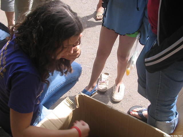 Lydia searches for shoes to fit the kids.