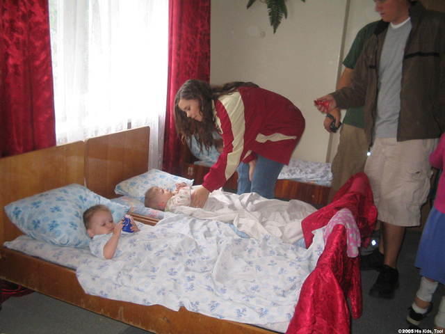 Lydia distributes toys to ALL the children.