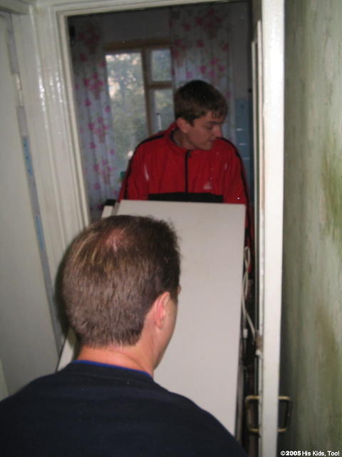 Moving a donated refrigerator for an elderly woman in Ukraine, she was thankful.