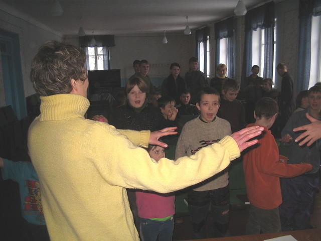 Vita and the other ladies sing along with the children, complete with the hand motions!