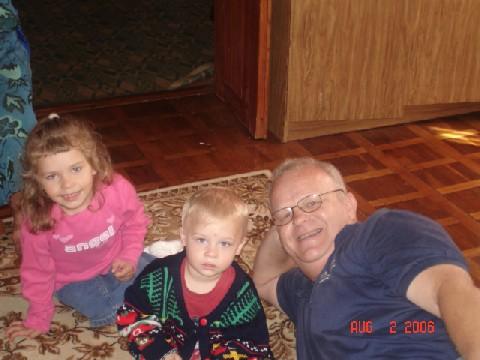Two of the kids with missionary Doug B., donation deliverer.