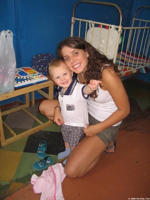 Haley is busy dressing children in new clothing.