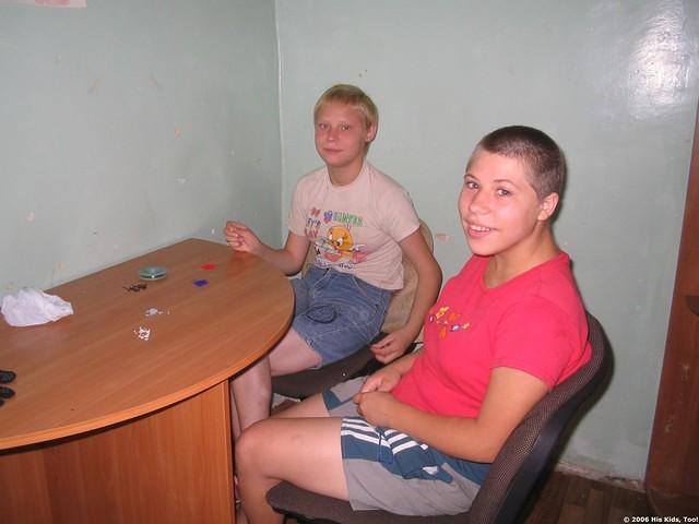 These young girls are working on bead necklaces.
