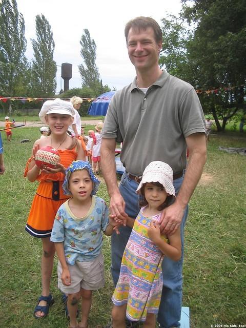 Board member, Ray G.  visits with some children.