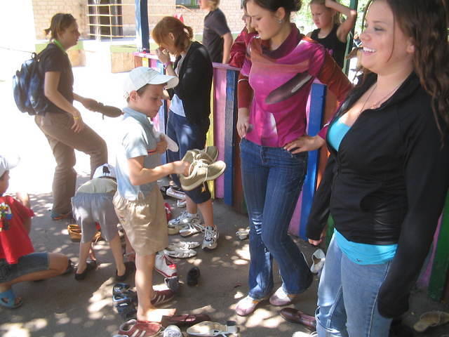At the Dzerzhinsk Orphan Shelter, children choose shoes.