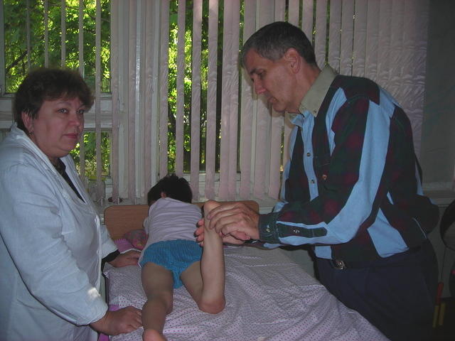At the Orthopedic Hospital, Kevin M. checks on some of the children there.