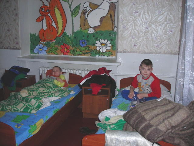 It was nap time, and kids piled their clothing up next to their bed space.