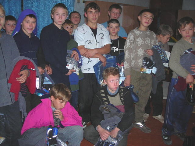 Boys received armfuls of clothing.