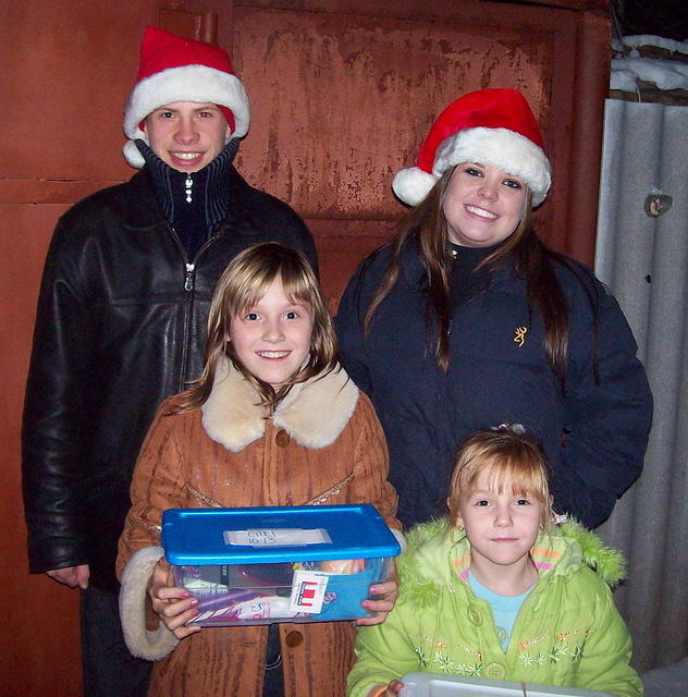 These neighborhood girls attend the weekly Bible study, and the young man is an orphan himself...he insisted on helping Lydia wi