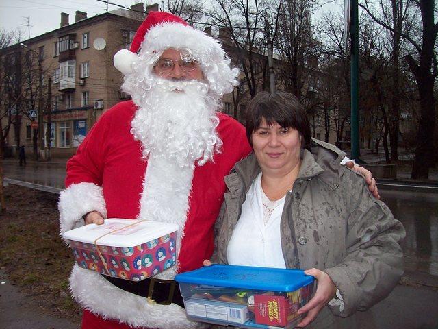 Here, the director enjoys having her photo with Santa.