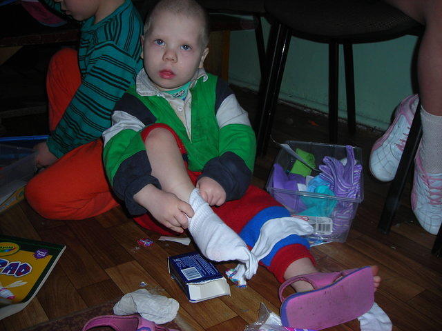 This little guy just HAD to put on his new socks!