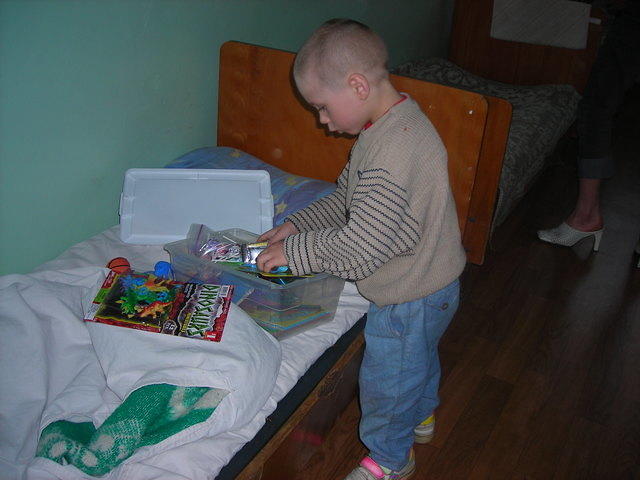 This boy carefully removed and organized his box.