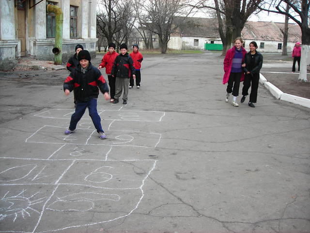 The kids play hop-scotch.  While waiting to go to dinner.
