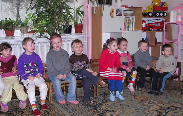 The kids listen intently.