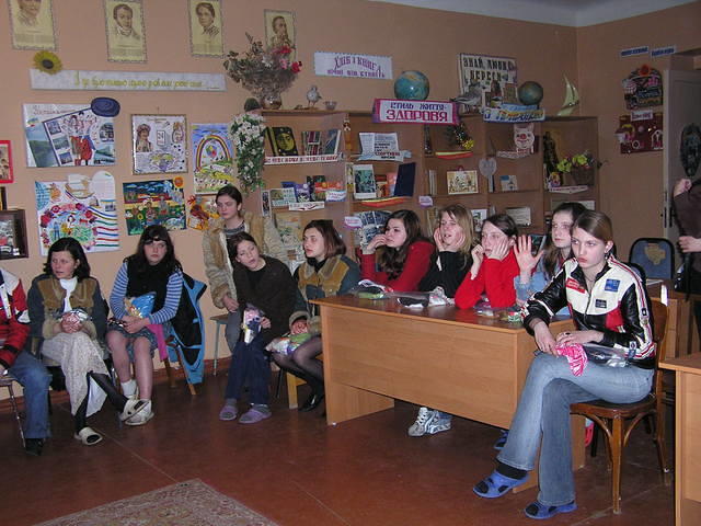 Teen girls wait for clothing, while...