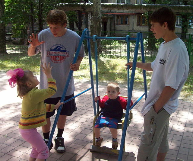 Vanya and Sergey interact with the kids.