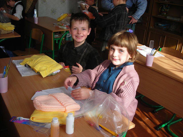 The children inspected what was in the bags.